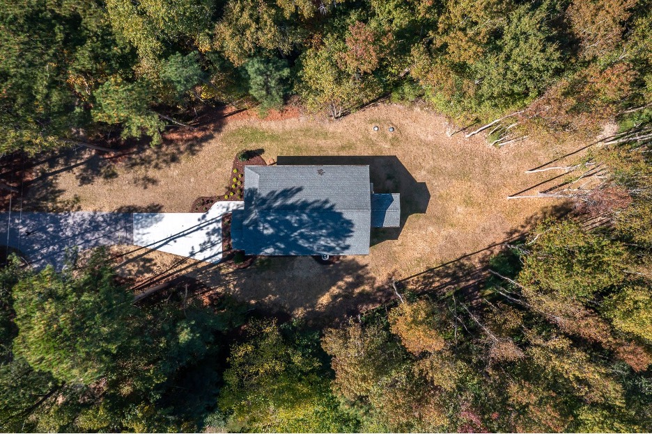 A bird’s-eye view of this newly built ranch home on 1 acre lot.
